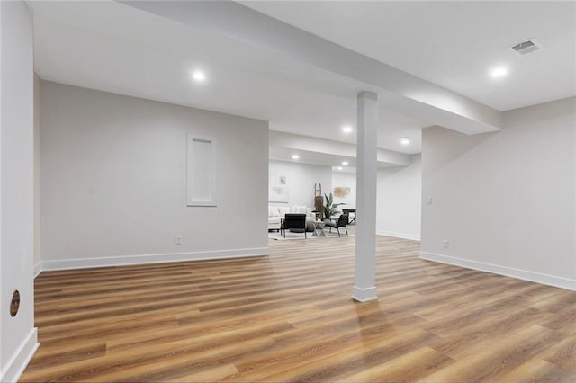 basement featuring wood-type flooring