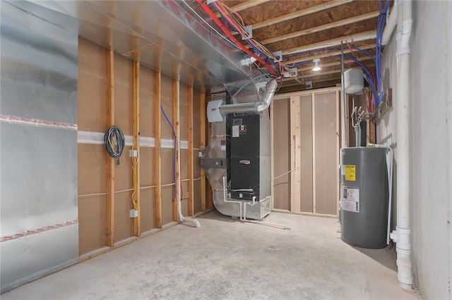 basement featuring electric water heater and heating unit