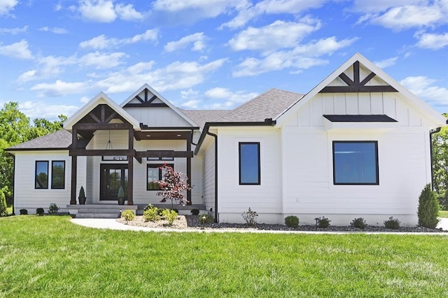 modern farmhouse style home featuring a front lawn