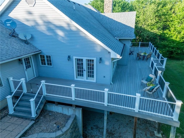 back of house featuring a wooden deck