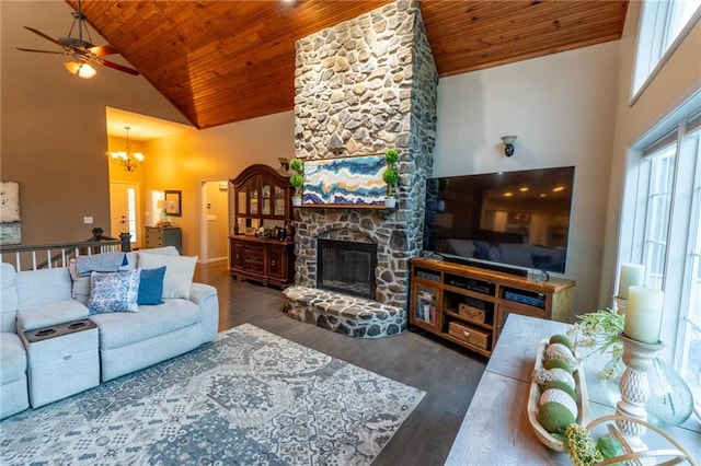 living room with high vaulted ceiling, wood ceiling, ceiling fan with notable chandelier, and a stone fireplace