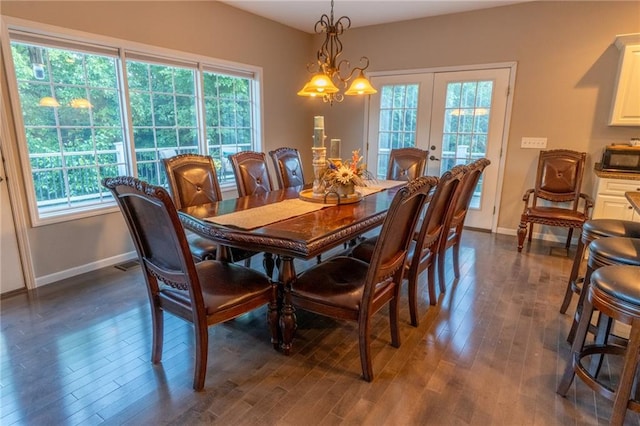 dining area with plenty of natural light and dark hardwood / wood-style floors