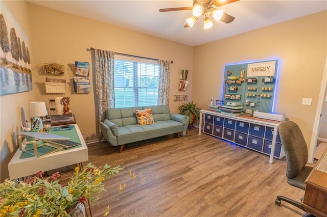 interior space featuring hardwood / wood-style floors and ceiling fan