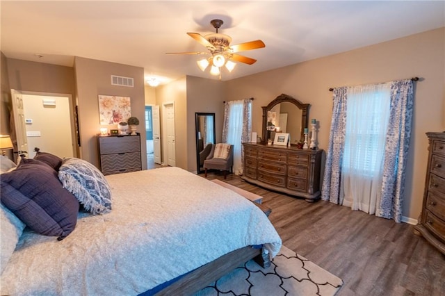 bedroom featuring ceiling fan and hardwood / wood-style flooring