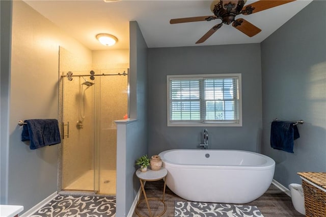 bathroom with independent shower and bath, hardwood / wood-style flooring, and ceiling fan