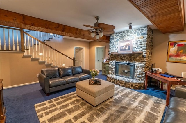 carpeted living room with a fireplace and ceiling fan