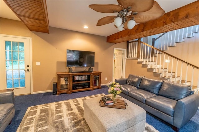 living room featuring ceiling fan, beam ceiling, and carpet flooring