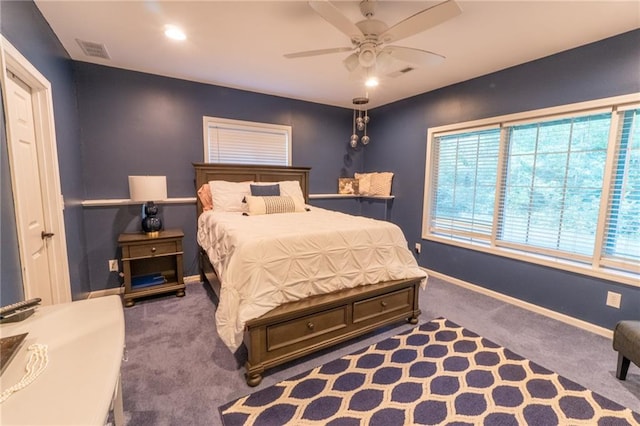 bedroom with dark colored carpet and ceiling fan