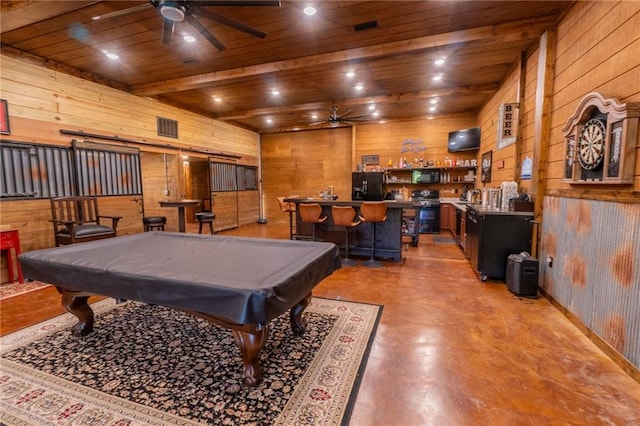 recreation room with billiards, wood walls, wooden ceiling, ceiling fan, and indoor bar