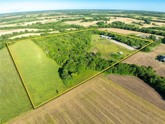 birds eye view of property with a rural view