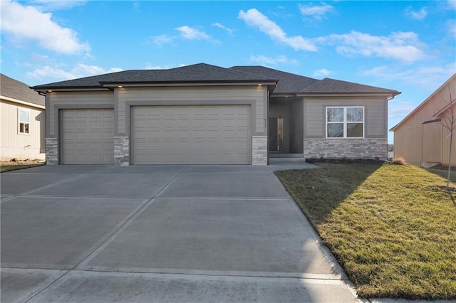 prairie-style house with a front yard and a garage