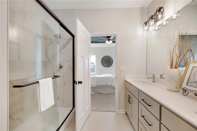 bathroom featuring ceiling fan, tile patterned flooring, vanity, and a shower with shower door