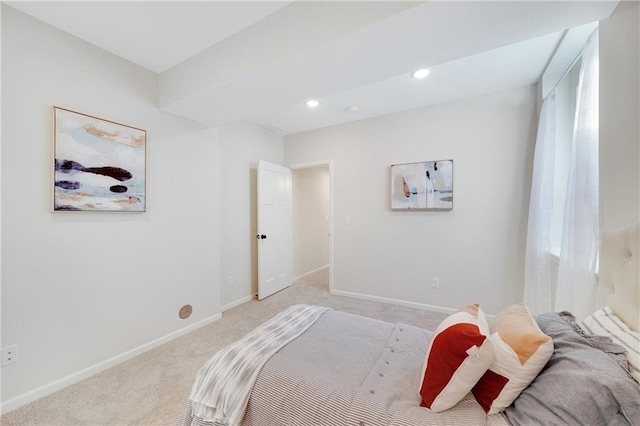 bedroom featuring light colored carpet