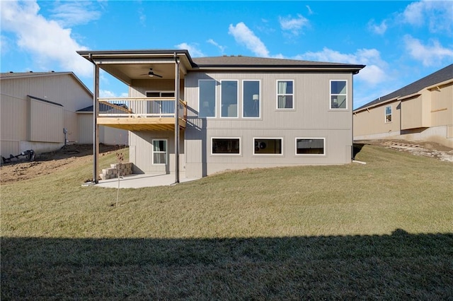 rear view of property with a yard