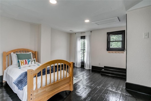 bedroom featuring dark hardwood / wood-style flooring