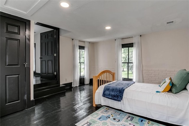 bedroom featuring dark hardwood / wood-style floors