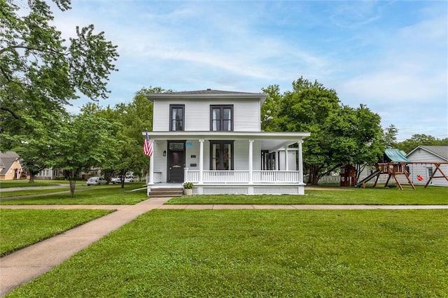 view of front of home featuring a playground, covered porch, and a front yard