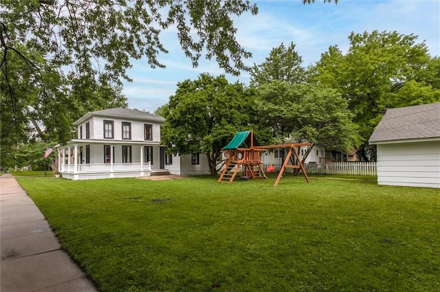 exterior space featuring a porch, a yard, and a playground