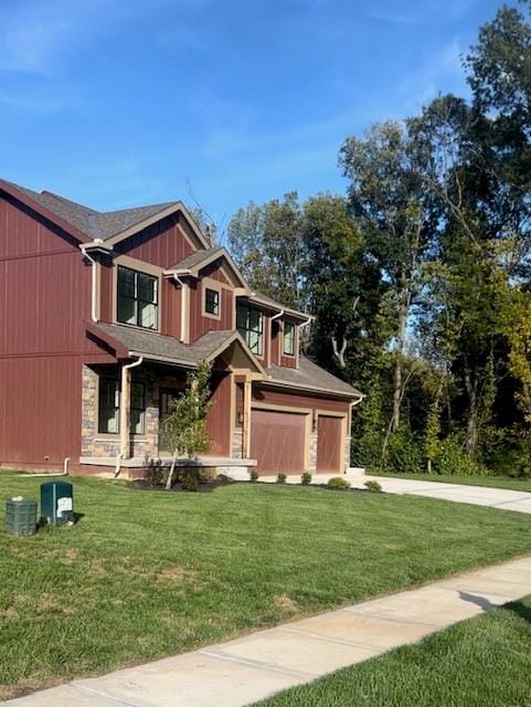 craftsman-style home with a front yard and a garage