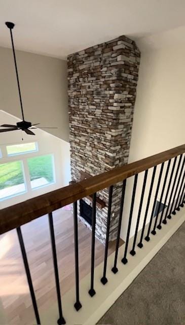 staircase featuring ceiling fan