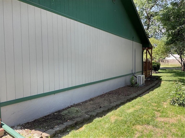 view of side of home featuring a yard