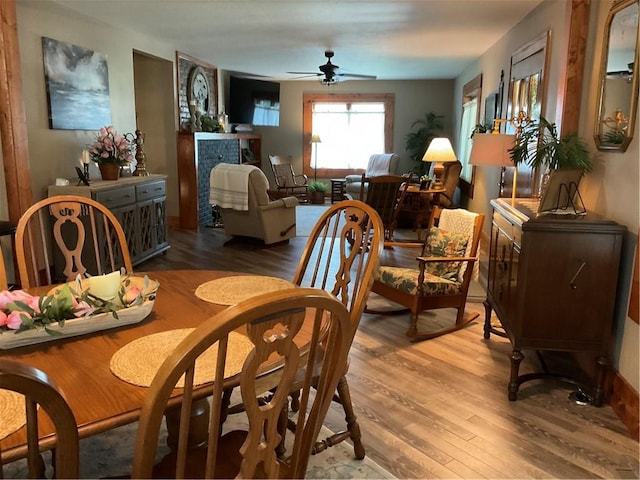 dining space featuring ceiling fan and hardwood / wood-style floors