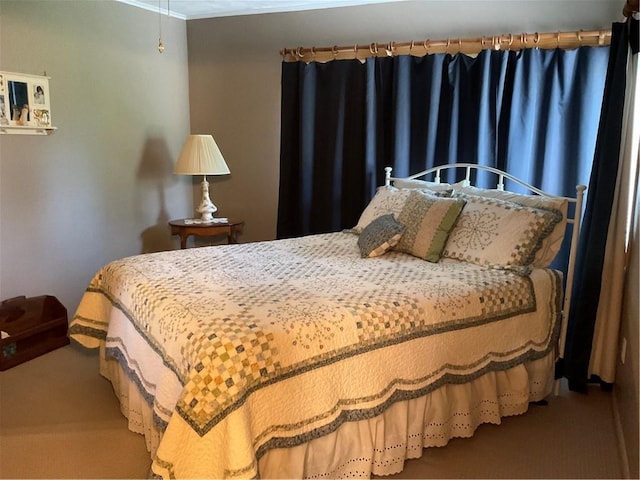 carpeted bedroom featuring crown molding