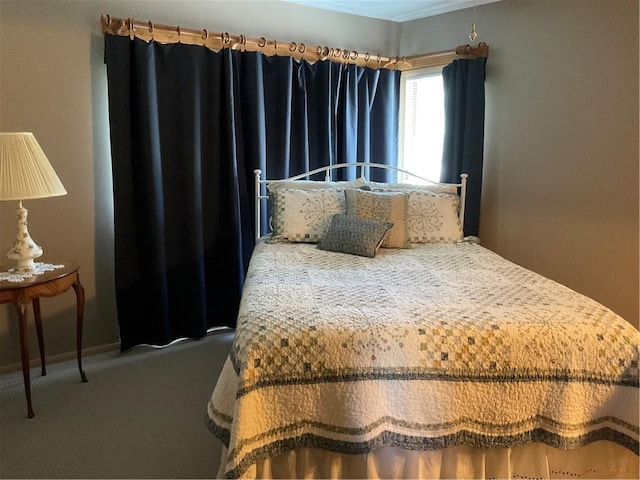 carpeted bedroom featuring ornamental molding