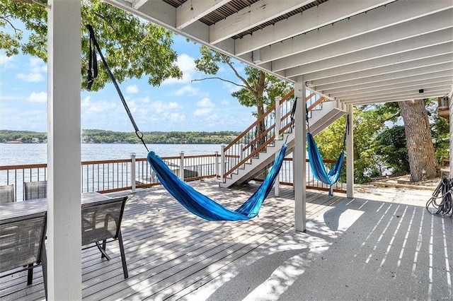 wooden deck featuring a water view