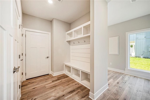 mudroom with light hardwood / wood-style floors