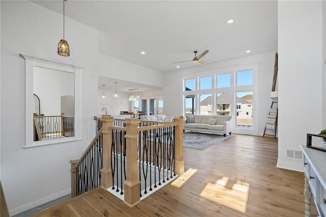 interior space featuring hardwood / wood-style flooring and ceiling fan