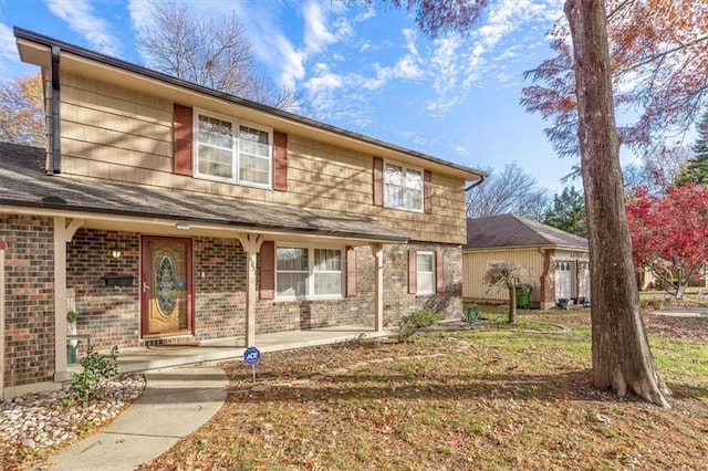 view of front property featuring covered porch