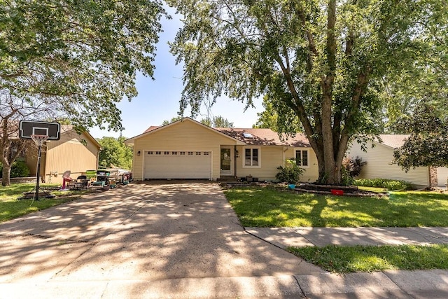 ranch-style home with a garage and a front yard