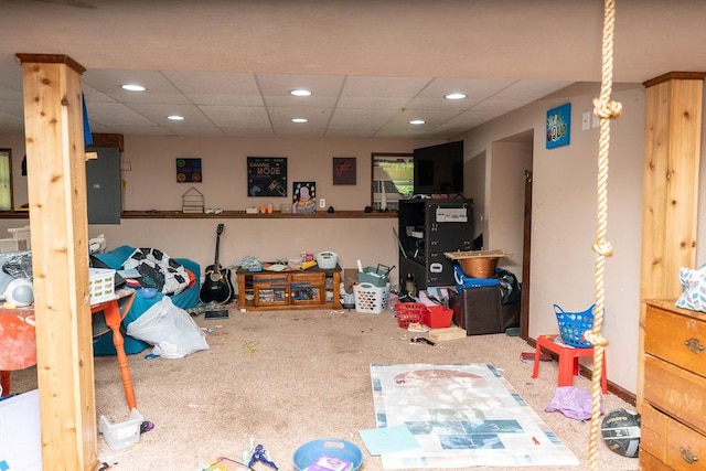 interior space featuring a drop ceiling and carpet flooring