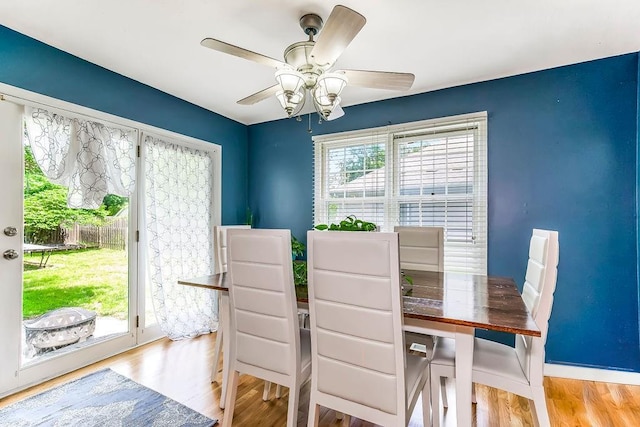 dining space featuring ceiling fan and light hardwood / wood-style floors