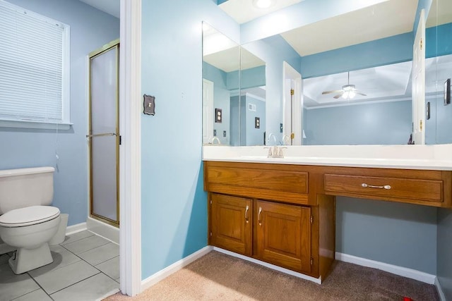 bathroom with tile patterned floors, toilet, an enclosed shower, vanity, and ceiling fan