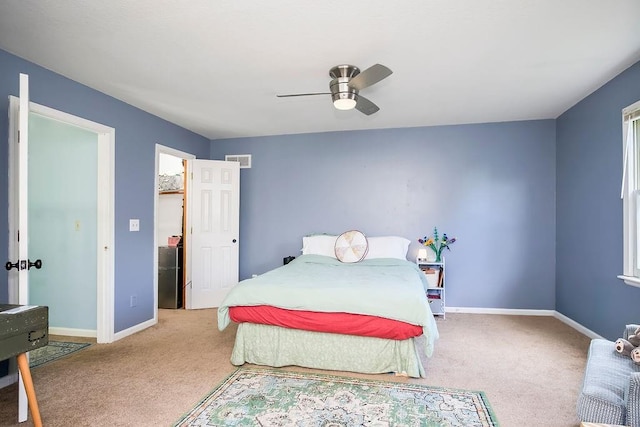 bedroom featuring fridge, carpet floors, and ceiling fan