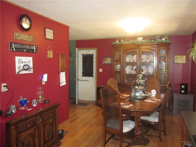 dining area featuring wood-type flooring