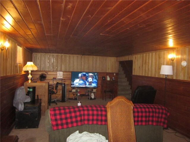 living room with wood ceiling, carpet floors, and wood walls