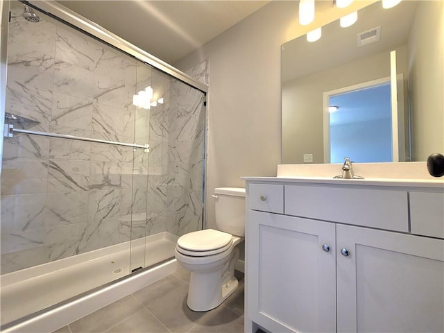 bathroom featuring a marble finish shower, vanity, toilet, and visible vents