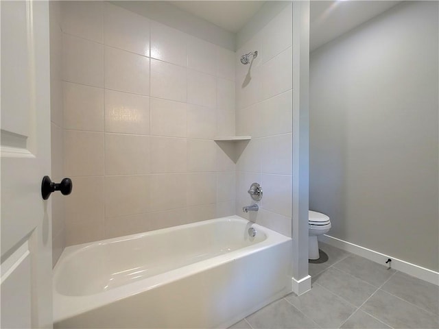full bathroom with tile patterned flooring, baseboards, washtub / shower combination, and toilet