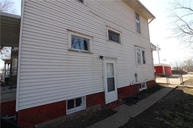 view of property exterior featuring fence