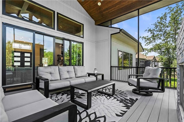 sunroom / solarium featuring wooden ceiling and vaulted ceiling