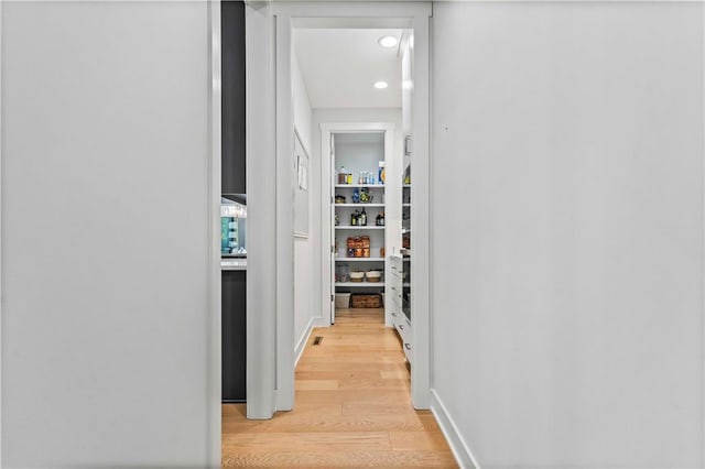 corridor featuring light wood-type flooring