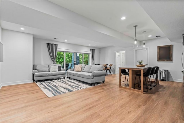 living room with light hardwood / wood-style floors