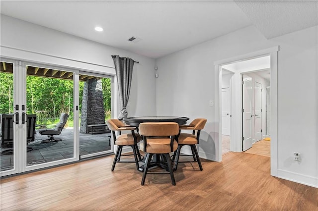 dining space featuring light hardwood / wood-style floors