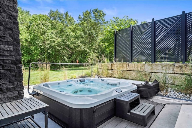 view of patio with a hot tub