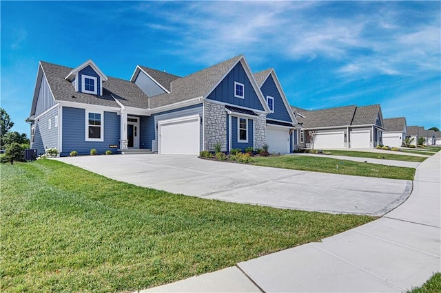 craftsman-style house with cooling unit and a front lawn