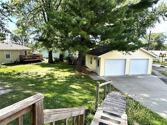 view of yard featuring a garage and a deck