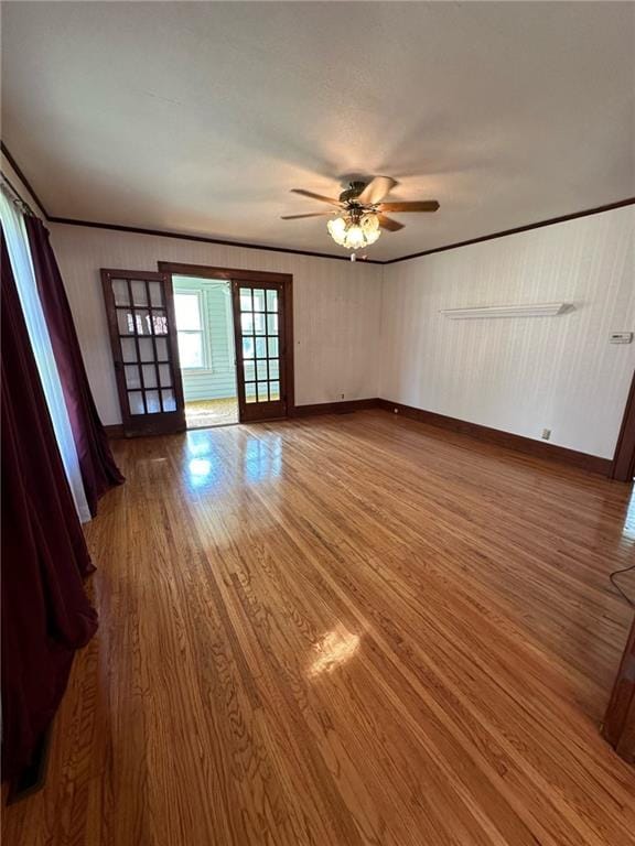 unfurnished room featuring hardwood / wood-style flooring and ceiling fan